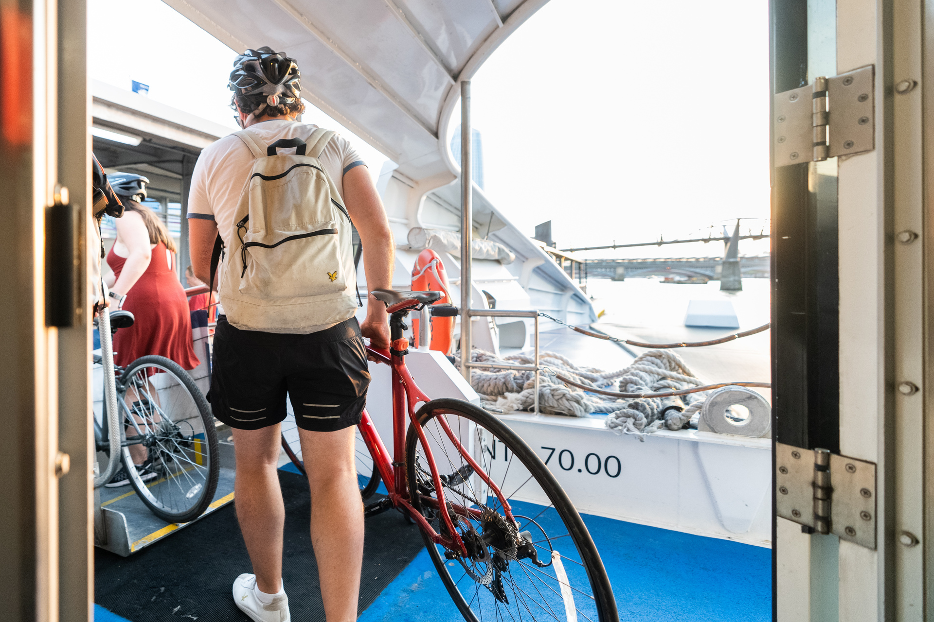 Cyclist Disembarking Uber Boat By Thames Clippers